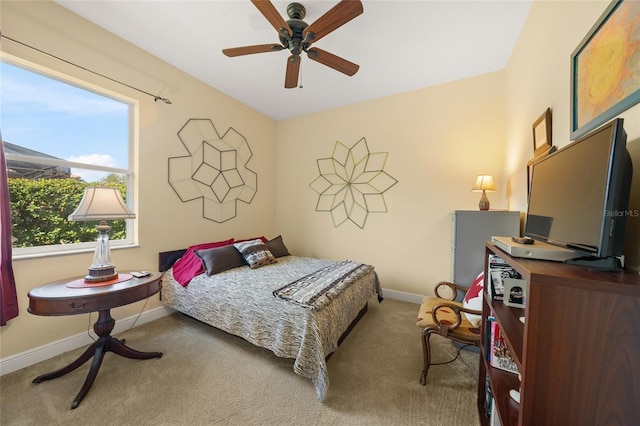 bedroom with ceiling fan and carpet floors