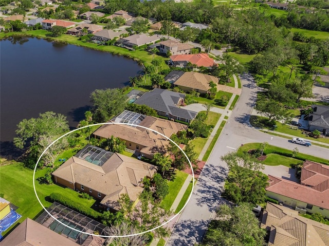 birds eye view of property with a water view