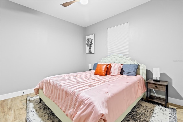 bedroom featuring ceiling fan and light hardwood / wood-style flooring