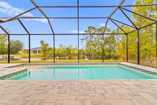 view of pool featuring a water view, a patio, and glass enclosure