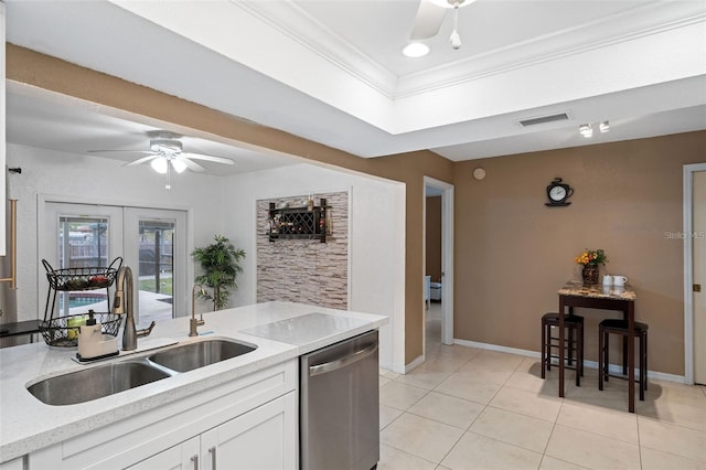 kitchen featuring sink, white cabinetry, stainless steel dishwasher, and crown molding