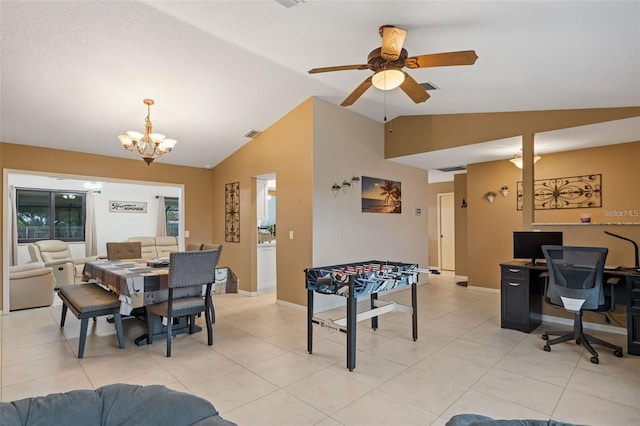 rec room featuring ceiling fan with notable chandelier, lofted ceiling, and light tile patterned flooring