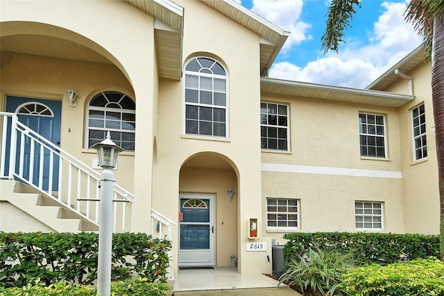 view of exterior entry with central AC