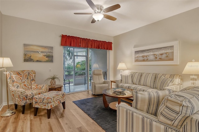 living room with ceiling fan and wood-type flooring