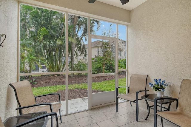 sunroom featuring ceiling fan