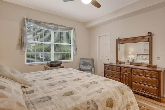 bedroom with light wood-type flooring and ceiling fan