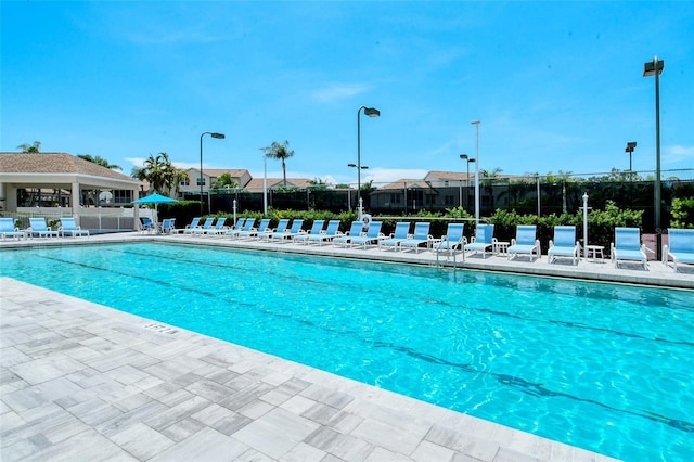 view of swimming pool featuring a patio area