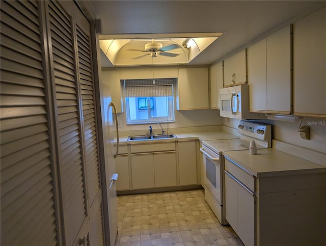 kitchen with ceiling fan, sink, and white appliances