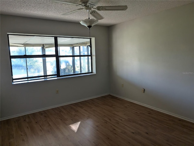 unfurnished room with hardwood / wood-style floors, a textured ceiling, and ceiling fan