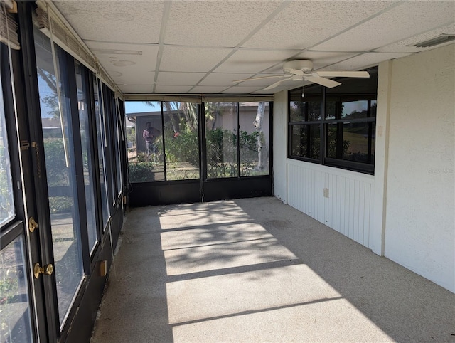 unfurnished sunroom featuring a paneled ceiling