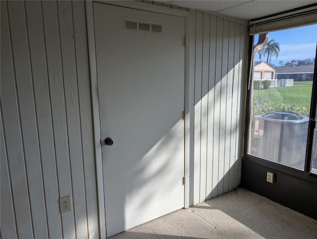 unfurnished sunroom with a paneled ceiling