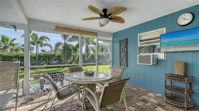 sunroom with cooling unit and ceiling fan