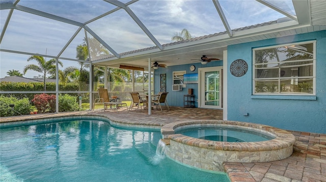 view of swimming pool with an in ground hot tub, ceiling fan, and a patio area