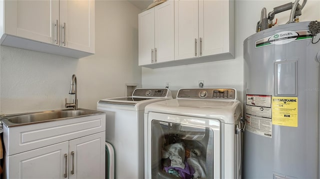 laundry room featuring washer and dryer, electric water heater, sink, and cabinets