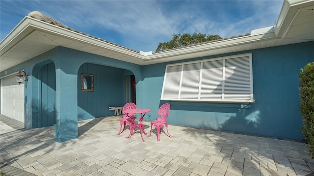 view of patio featuring a garage