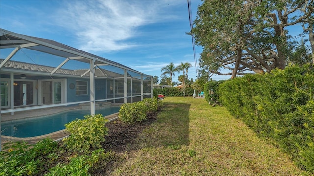 view of yard with glass enclosure