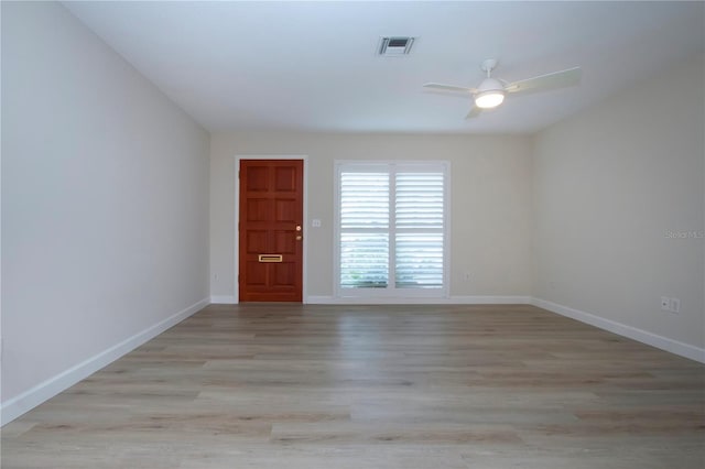 unfurnished room with ceiling fan and light hardwood / wood-style floors