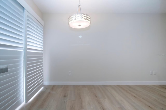 empty room with light hardwood / wood-style floors