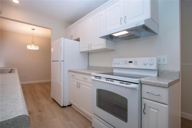 kitchen with white appliances, white cabinets, decorative light fixtures, sink, and light hardwood / wood-style flooring