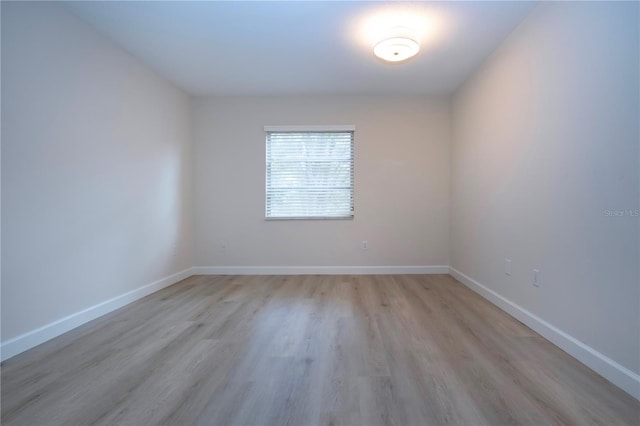 spare room featuring light wood-type flooring