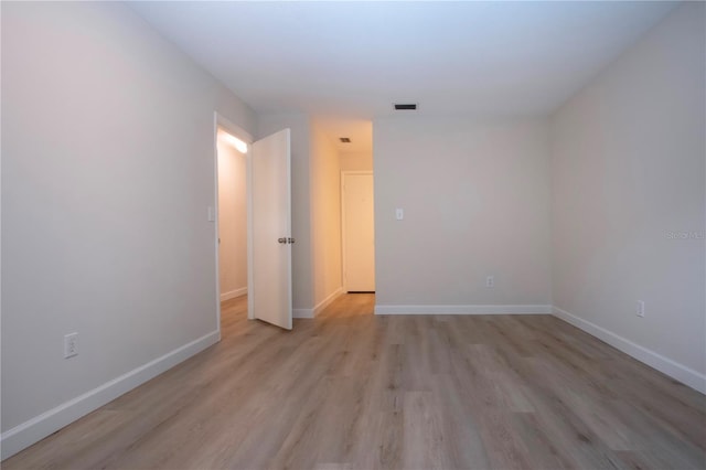 unfurnished room featuring light hardwood / wood-style floors