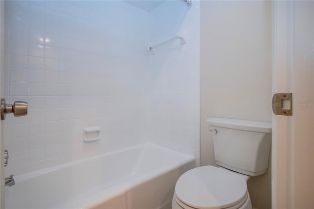 bathroom featuring toilet and shower / washtub combination