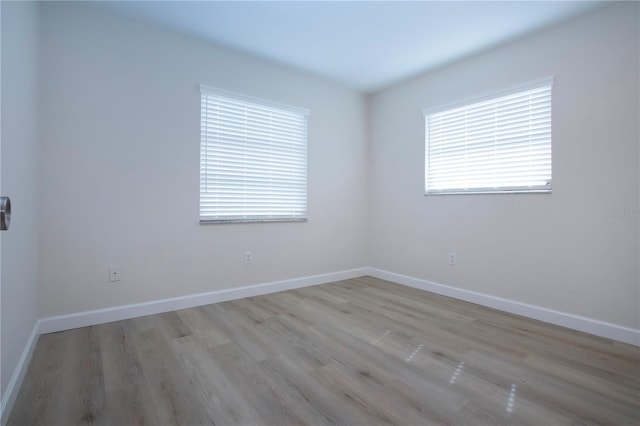 unfurnished room featuring light wood-type flooring