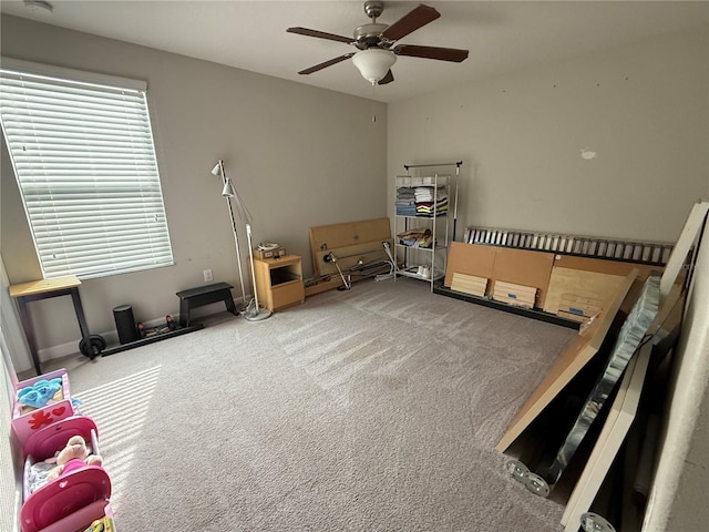 miscellaneous room with carpet floors and ceiling fan