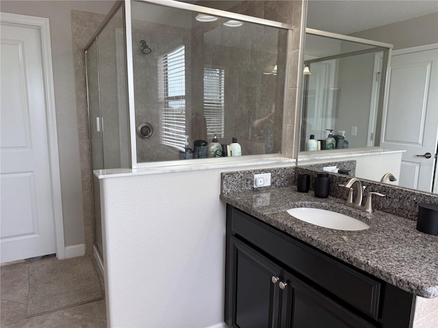 bathroom with walk in shower and vanity