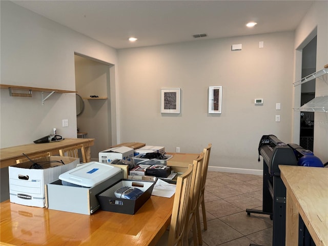 dining space with tile patterned flooring