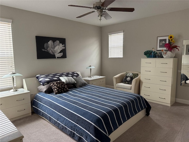 bedroom featuring light carpet and ceiling fan