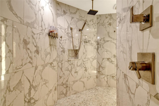 bathroom with tiled shower