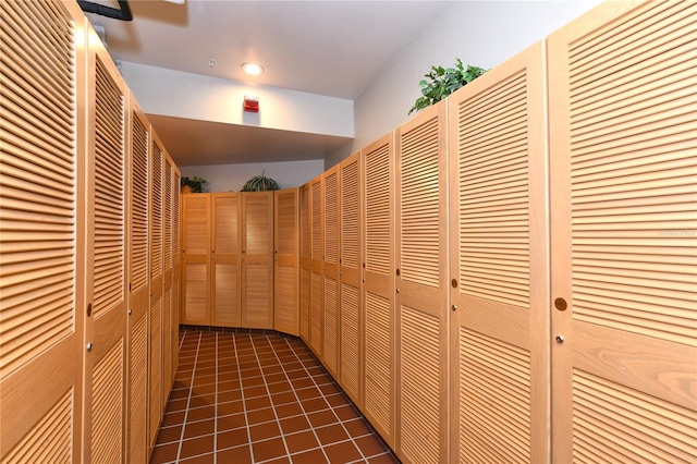 corridor with dark tile patterned floors