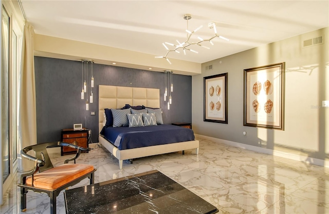 bedroom featuring an inviting chandelier