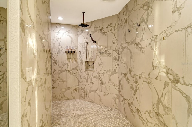 bathroom with tiled shower