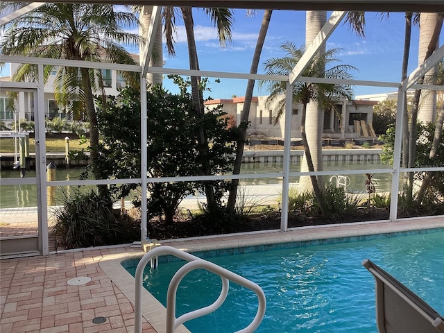 view of pool featuring a lanai