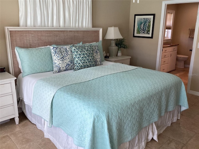 bedroom featuring ensuite bathroom