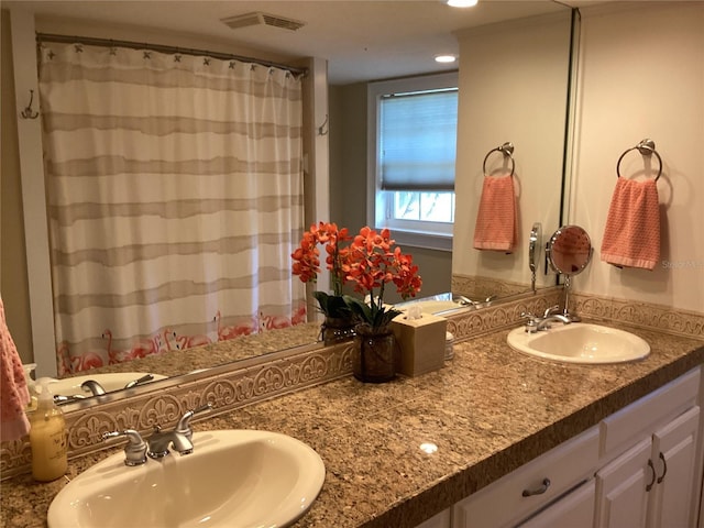 bathroom featuring vanity and walk in shower