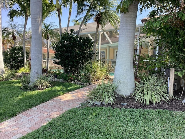 view of yard featuring a lanai