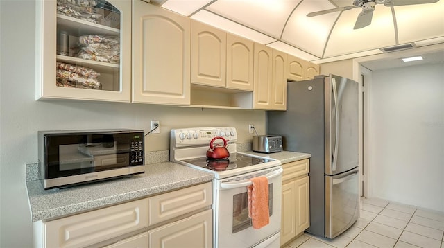 kitchen featuring ceiling fan, light tile patterned floors, and appliances with stainless steel finishes