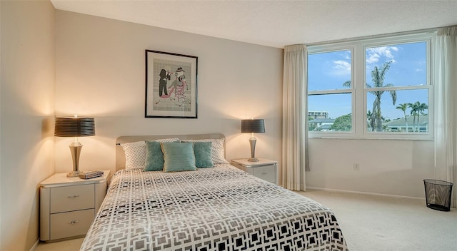 carpeted bedroom featuring multiple windows