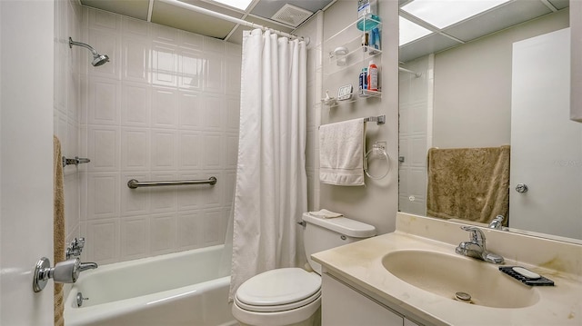 full bathroom featuring toilet, shower / bath combination with curtain, and vanity