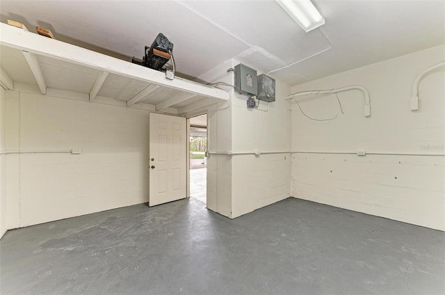 garage with concrete block wall