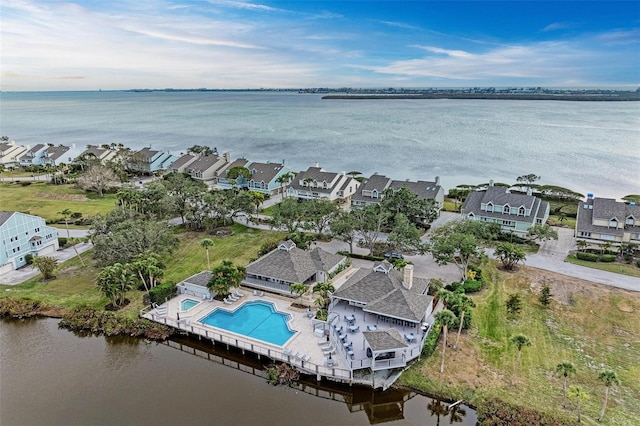 drone / aerial view with a water view and a residential view