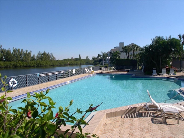 pool featuring a patio area and fence