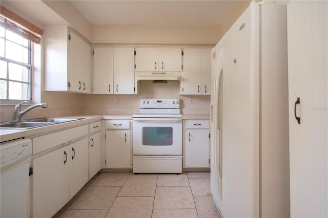 kitchen featuring sink, light tile patterned flooring, white appliances, and white cabinetry