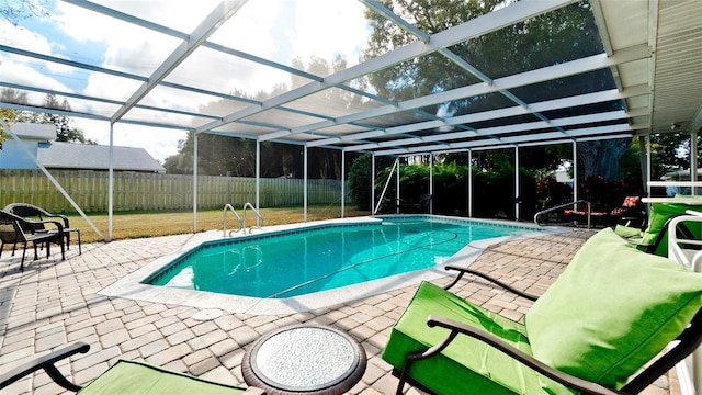 view of pool featuring a lanai and a patio