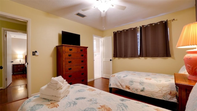 bedroom featuring ceiling fan and dark hardwood / wood-style flooring