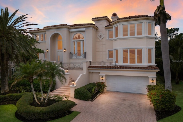 mediterranean / spanish house featuring a garage