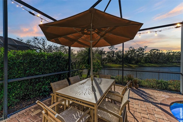 patio terrace at dusk with a water view